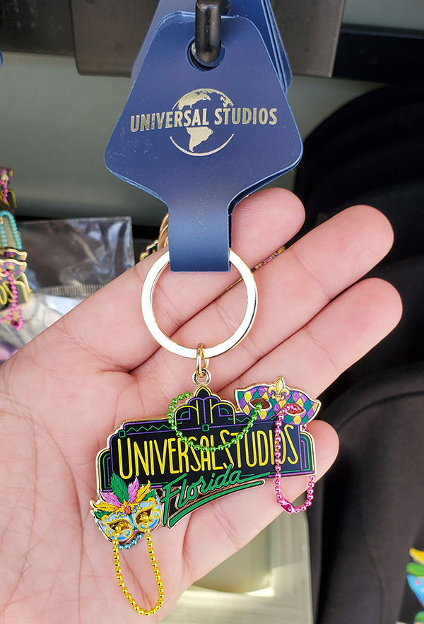 Universal Studios Orlando Florida Mardi Gras 2021 Retro Logo Marquee Beads Keychain